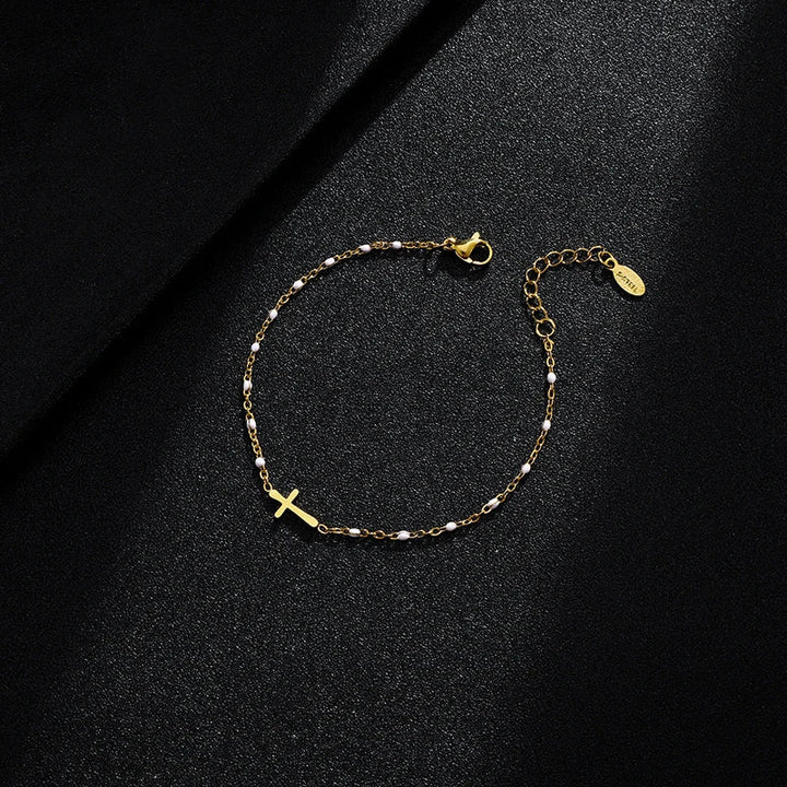 W&W Mode | Goldfarbene Kreuzarmband